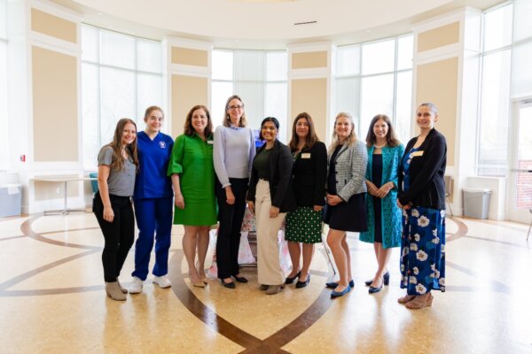 Group photograph in the Cecil Pruitt Jr. Health & Life Sciences Building rotunda.