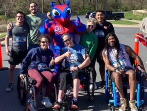 Group gathered for the inaugural Buzzy's Race for Research organized by ĻӰ physical therapy students in April 2024. Group includes wheelchair users who "rolled" at the event, which benefits The Foundation for Physical Therapy research awards